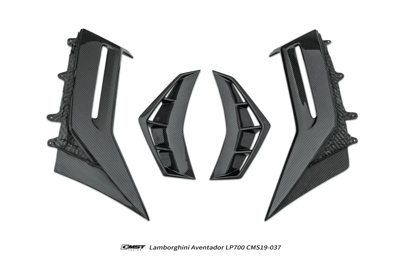 Carbon fiber front fender panels with vents, laid out on a white studio floor